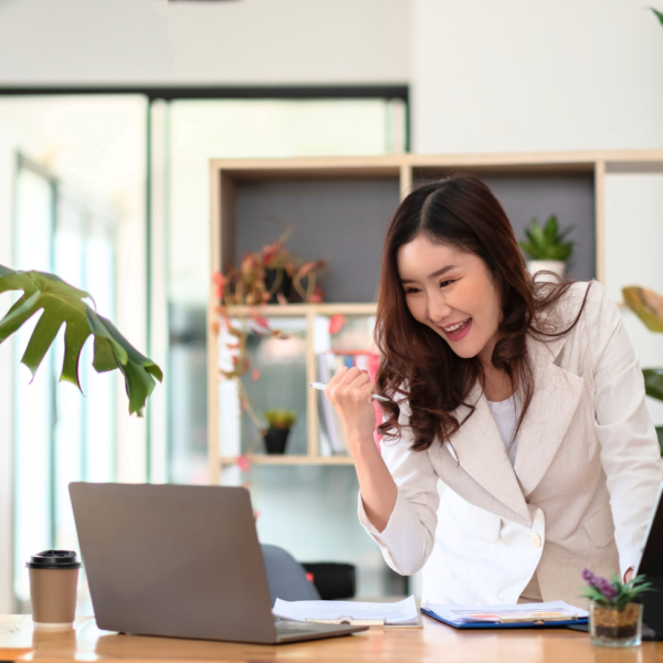 woman excited in her home office