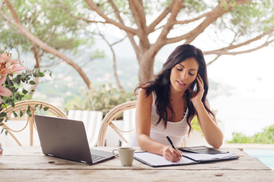 woman working from outdoor table