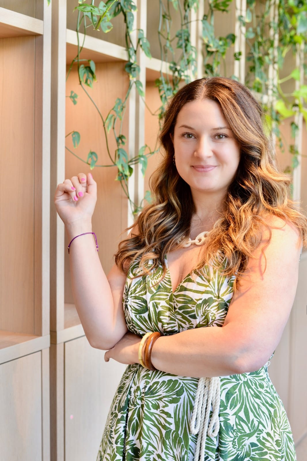 Marybeth Welty in green and white dress in beautiful office